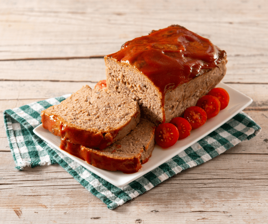 The Ultimate Guide to Smoked Meatloaf Recipe 1 Smoked meatloaf Recipe cooking on a smoker grill with hickory wood chips.